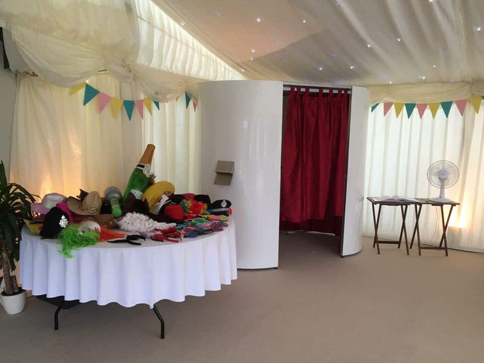 White Photo Booth at Event With Props